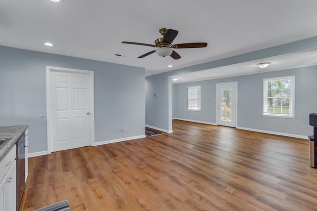 2920 Newmans Neck Rd, Heathsville, VA 22473 - unfurnished living room with ceiling fan, baseboards, light wood-style flooring, and recessed lighting
