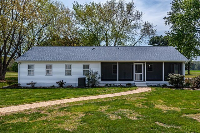 2920 Newmans Neck Rd, Heathsville, VA 22473 - ranch-style house with a sunroom, a front lawn, cooling unit, and roof with shingles