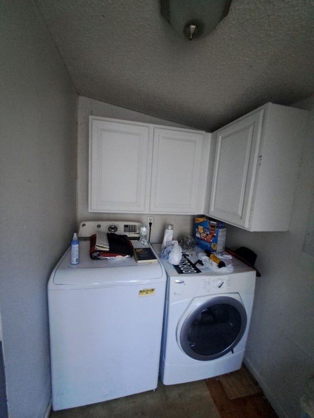 laundry area with cabinets and separate washer and dryer