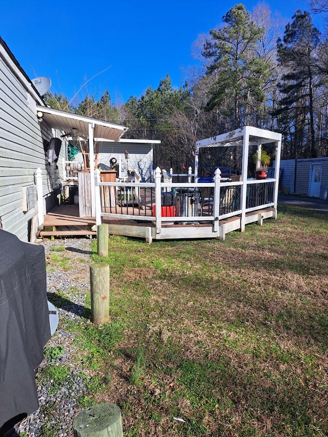 view of yard featuring a wooden deck