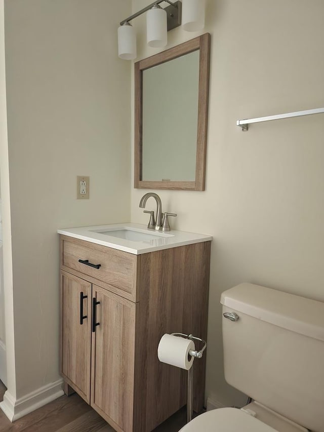 827 Travelers Rest Rd, Hague, VA 22469 - half bath with vanity and wood finished floors