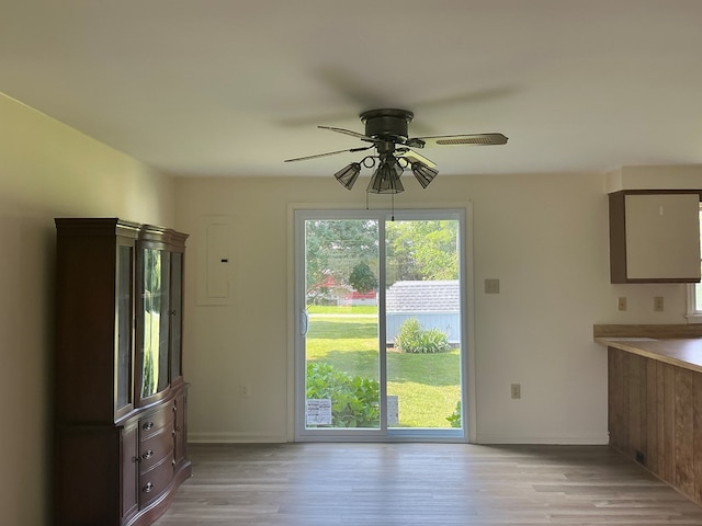 827 Travelers Rest Rd, Hague, VA 22469 - unfurnished dining area featuring a ceiling fan, light wood-style floors, and electric panel