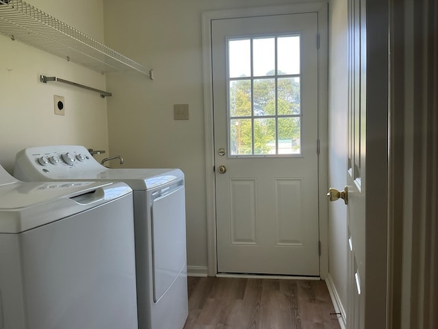 827 Travelers Rest Rd, Hague, VA 22469 - laundry room with washer and clothes dryer and wood finished floors