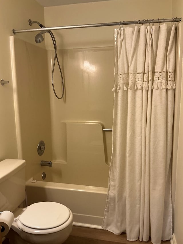 827 Travelers Rest Rd, Hague, VA 22469 - bathroom with shower / bath combination with curtain and wood finished floors