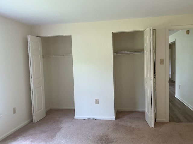 827 Travelers Rest Rd, Hague, VA 22469 - unfurnished bedroom with two closets and carpet