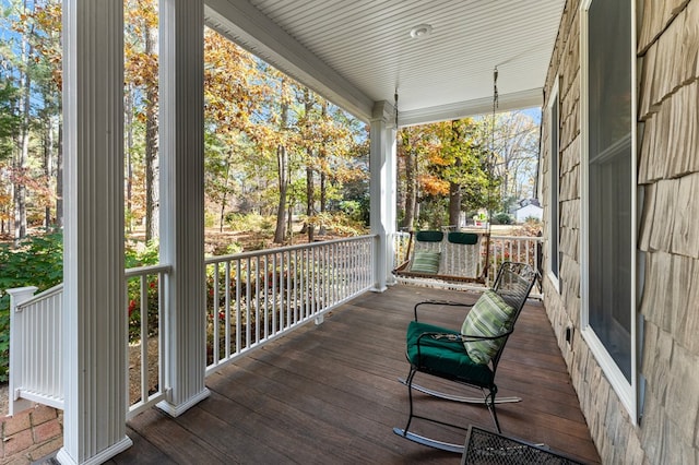 wooden deck featuring a porch