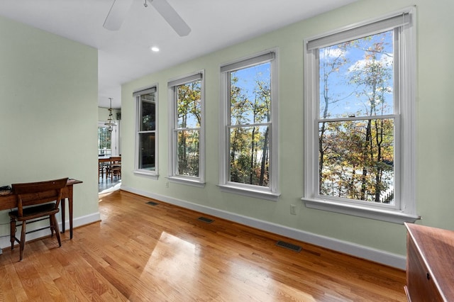 interior space featuring ceiling fan and light hardwood / wood-style flooring