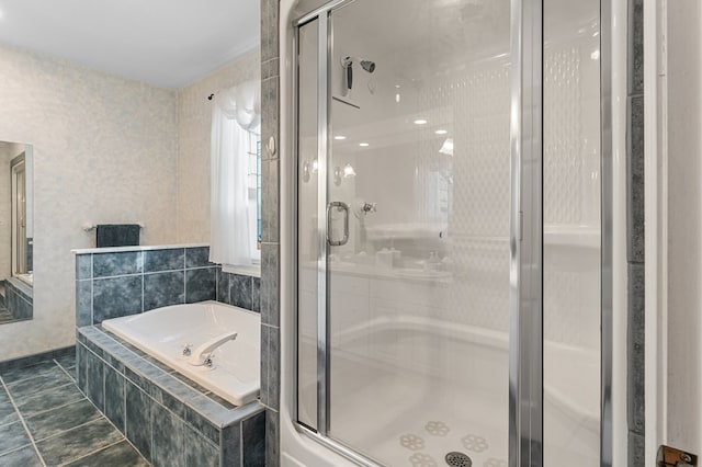 bathroom with tile patterned flooring and separate shower and tub