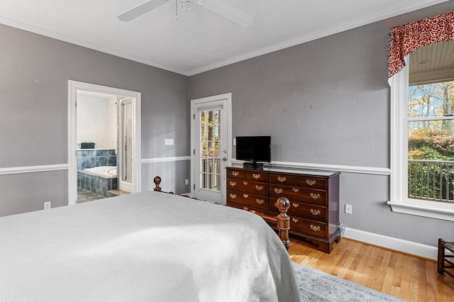 bedroom with hardwood / wood-style floors, ensuite bath, ceiling fan, and crown molding