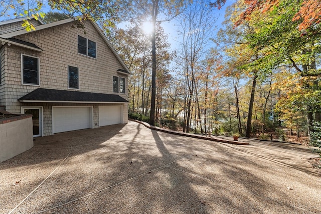 view of side of property featuring a garage