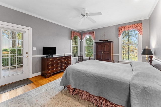 bedroom featuring light wood-type flooring, access to outside, ceiling fan, and crown molding