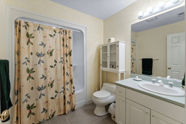 full bathroom with tile patterned flooring, shower / tub combo, vanity, and toilet