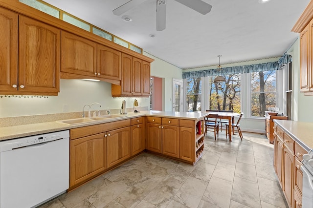 kitchen featuring kitchen peninsula, ceiling fan, sink, dishwasher, and hanging light fixtures