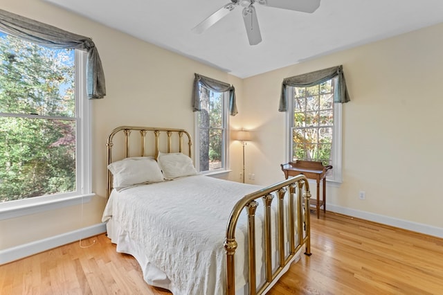 bedroom with ceiling fan and hardwood / wood-style floors