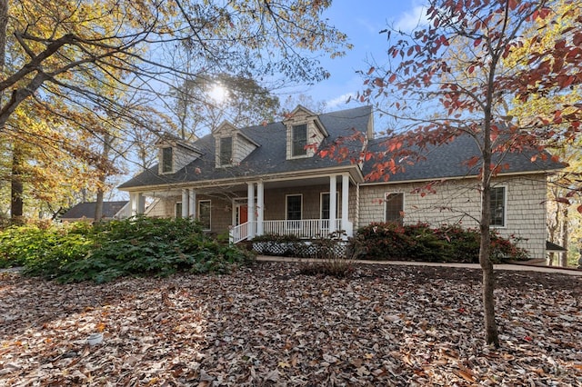 cape cod home with a porch