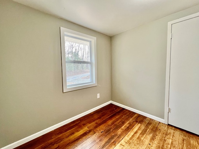 unfurnished room featuring hardwood / wood-style floors