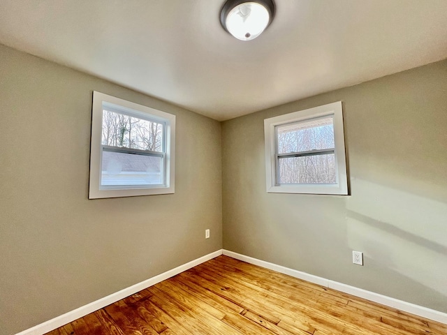 unfurnished room with light hardwood / wood-style floors