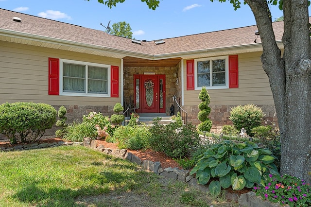 309 Nomini Bay Dr, Montross, VA 22520 - doorway to property featuring a yard, stone siding, and a shingled roof
