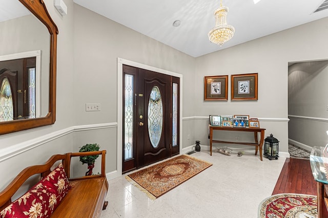 309 Nomini Bay Dr, Montross, VA 22520 - foyer with baseboards and a chandelier