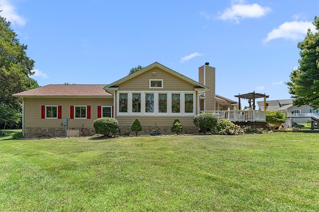 309 Nomini Bay Dr, Montross, VA 22520 - rear view of property featuring a yard, a wooden deck, and a chimney