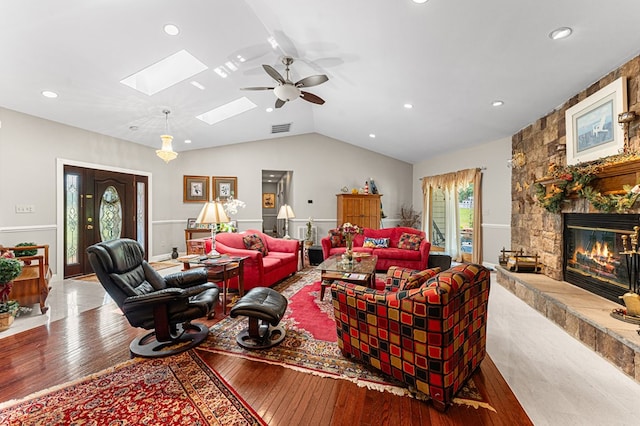 309 Nomini Bay Dr, Montross, VA 22520 - living area with hardwood / wood-style floors, a ceiling fan, vaulted ceiling, a skylight, and a fireplace