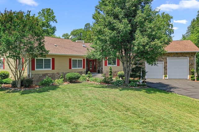 309 Nomini Bay Dr, Montross, VA 22520 - ranch-style home with stone siding, a front lawn, asphalt driveway, and an attached garage