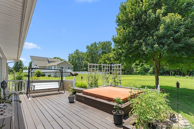 309 Nomini Bay Dr, Montross, VA 22520 - deck featuring a covered hot tub, a yard, and view of wooded area