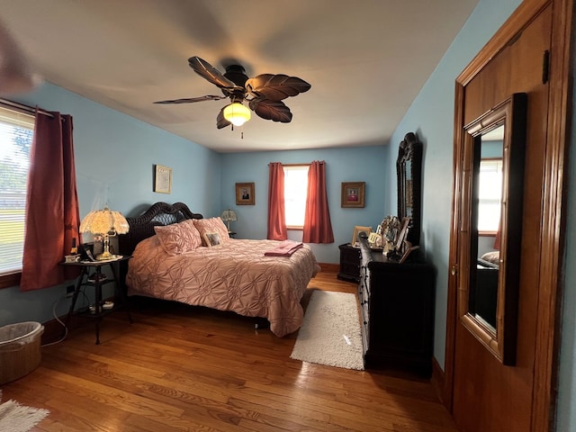 bedroom featuring a ceiling fan and wood finished floors