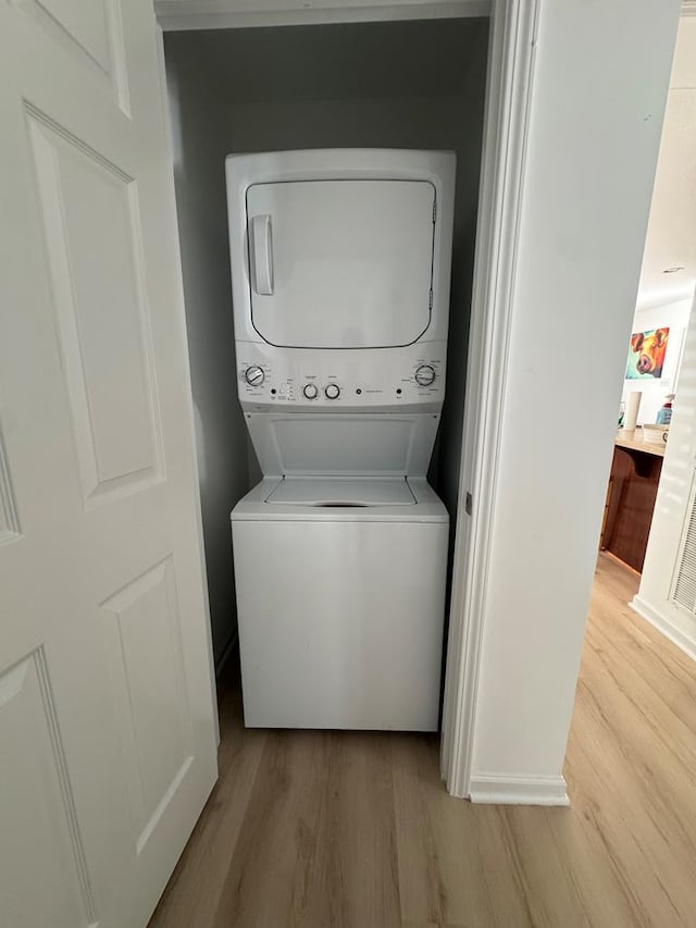 230 Roseneath Ave, Kilmarnock, VA 22482 - washroom featuring estacked washer and dryer and light wood finished floors
