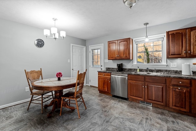 kitchen with stainless steel dishwasher, pendant lighting, sink, and an inviting chandelier