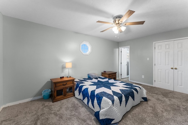 carpeted bedroom with ceiling fan, a closet, and a textured ceiling