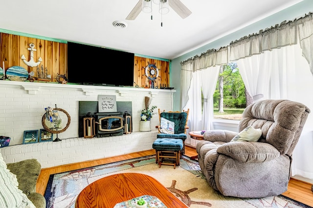 62 Denver Rd, Heathsville, VA 22473 - living room featuring a wood stove, ceiling fan, and light wood-type flooring
