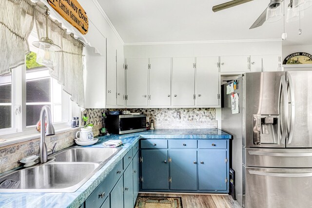 62 Denver Rd, Heathsville, VA 22473 - kitchen featuring appliances with stainless steel finishes, a sink, blue cabinets, ceiling fan, and crown molding