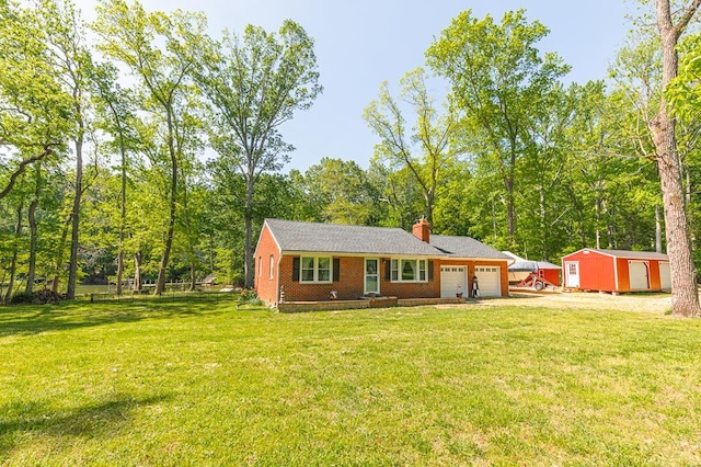 62 Denver Rd, Heathsville, VA 22473 - rear view of house with an attached garage, a chimney, a yard, and driveway