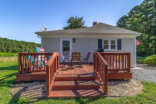 wooden deck with outdoor dining space