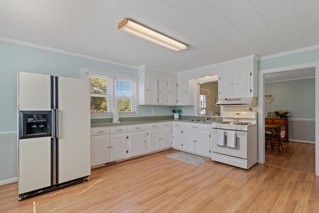 kitchen with light wood-style flooring, white cabinetry, white appliances, plenty of natural light, and under cabinet range hood