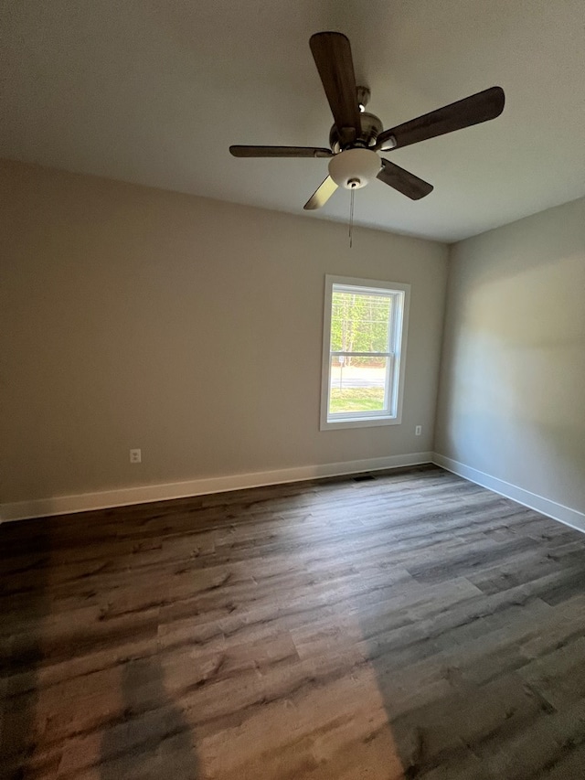 366 N Glebe Rd, Montross, VA 22520 - spare room featuring dark wood-type flooring, baseboards, and ceiling fan