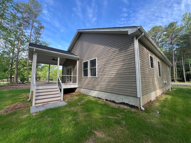 366 N Glebe Rd, Montross, VA 22520 - view of side of property with a ceiling fan, a yard, and covered porch