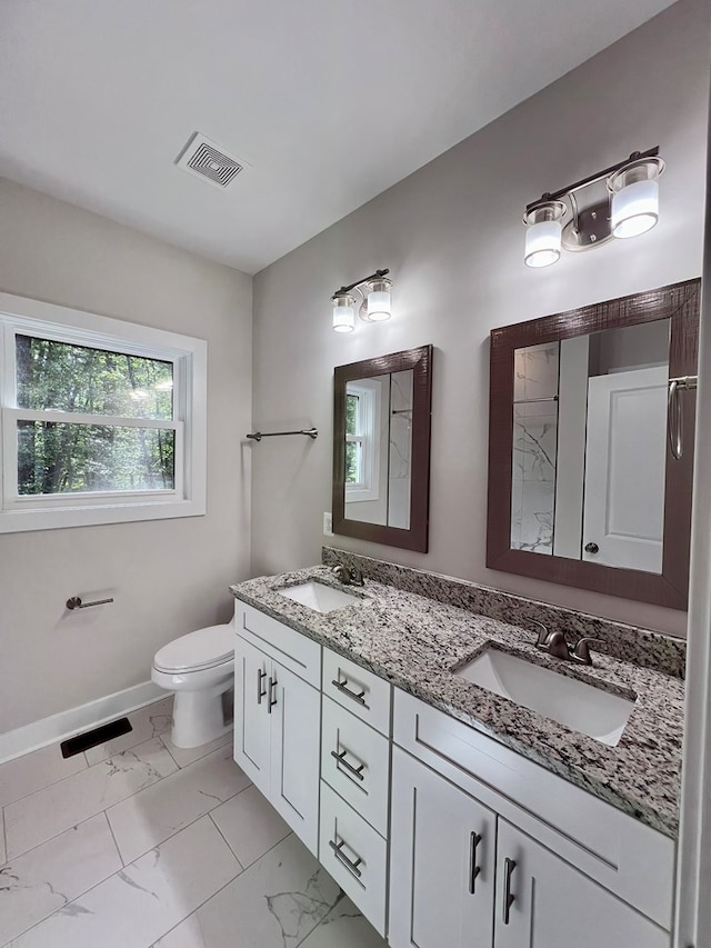 366 N Glebe Rd, Montross, VA 22520 - full bath with double vanity, marble look tiles, toilet, and baseboards