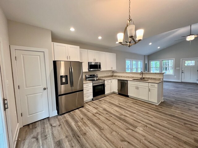 366 N Glebe Rd, Montross, VA 22520 - kitchen with stainless steel appliances, a sink, light wood finished floors, recessed lighting, and white cabinets