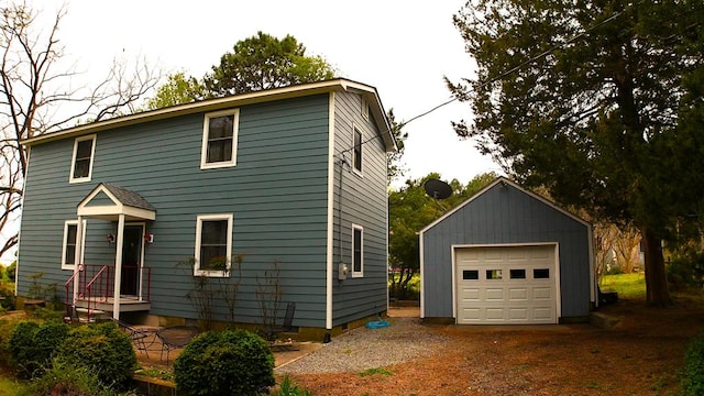 2012 Millenbeck Rd, Lancaster, VA 22503 - colonial house featuring a detached garage, driveway, and an outbuilding