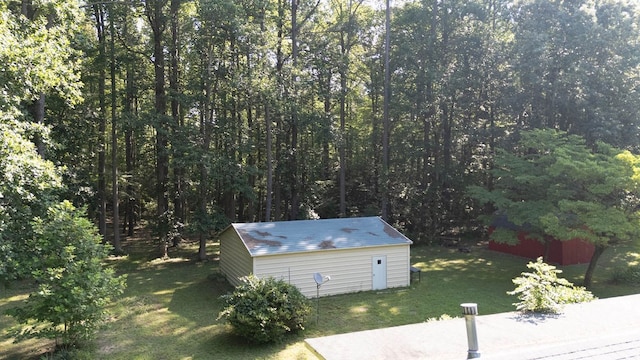 1026 Hoecake Rd, Lancaster, VA 22503 - view of grassy yard featuring an outbuilding and a forest view