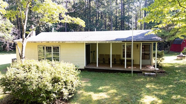 1026 Hoecake Rd, Lancaster, VA 22503 - rear view of property with a yard, a chimney, and covered porch