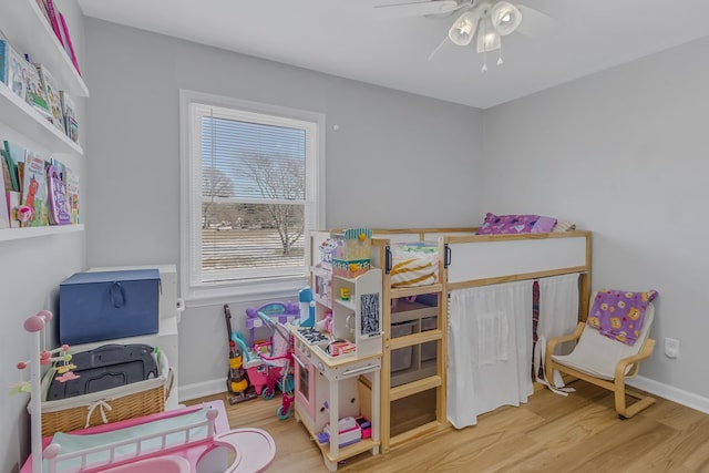 bedroom featuring light hardwood / wood-style floors and ceiling fan