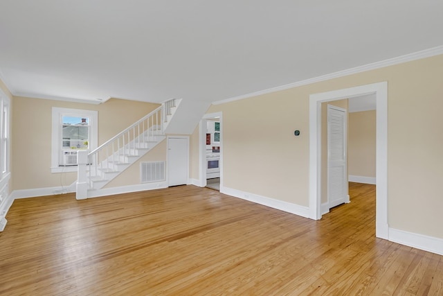 19 Wharton Grove Ln, Weems, VA 22576 - unfurnished living room with crown molding, stairway, light wood finished floors, and cooling unit