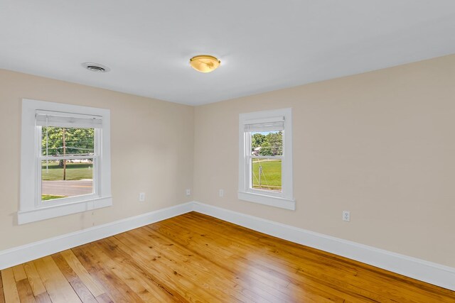 19 Wharton Grove Ln, Weems, VA 22576 - spare room featuring light wood-type flooring and healthy amount of natural light