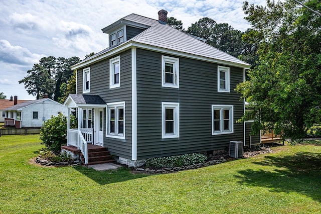19 Wharton Grove Ln, Weems, VA 22576 - rear view of house featuring a chimney