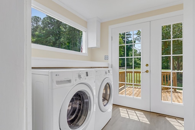 19 Wharton Grove Ln, Weems, VA 22576 - laundry area featuring french doors, independent washer and dryer, plenty of natural light, and crown molding