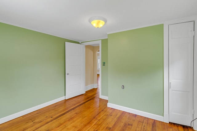 19 Wharton Grove Ln, Weems, VA 22576 - unfurnished bedroom featuring light wood-type flooring and ornamental molding