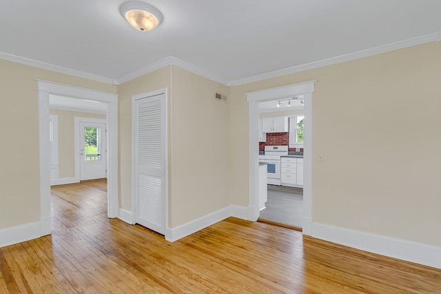 19 Wharton Grove Ln, Weems, VA 22576 - empty room with light wood-type flooring and crown molding